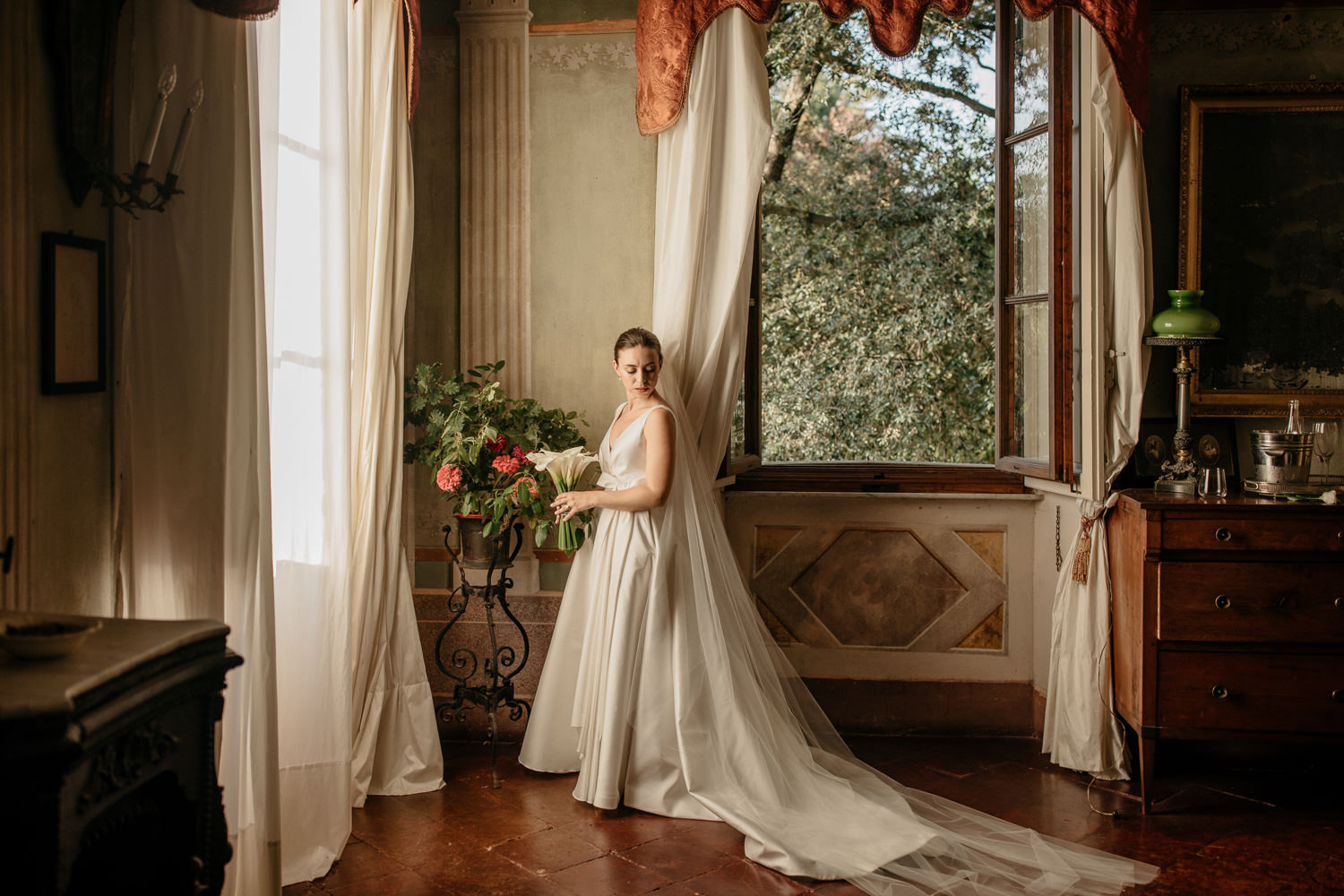 Bride in her wedding dress getting ready at Borgo Stomennano during her wedding in Tuscany